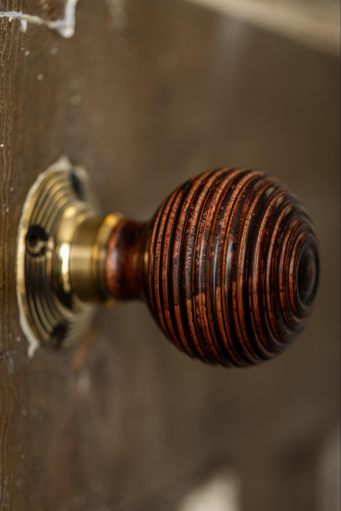 Victorian hardwood beehive brass door knob