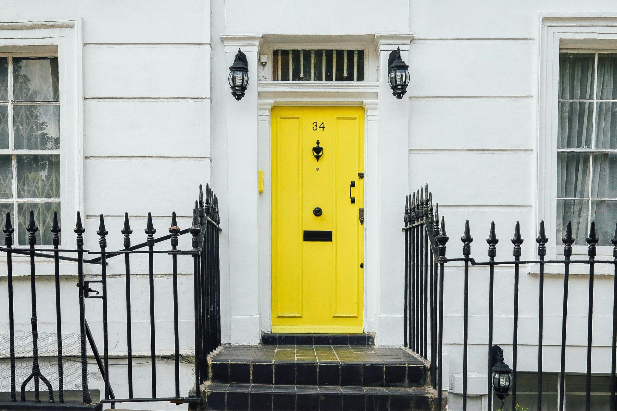 preserving historic character with yellow door